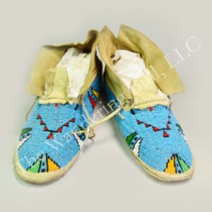 These fully Beaded Blue Moccasins with Rawhide Soles are made in the Cheyenne Style.